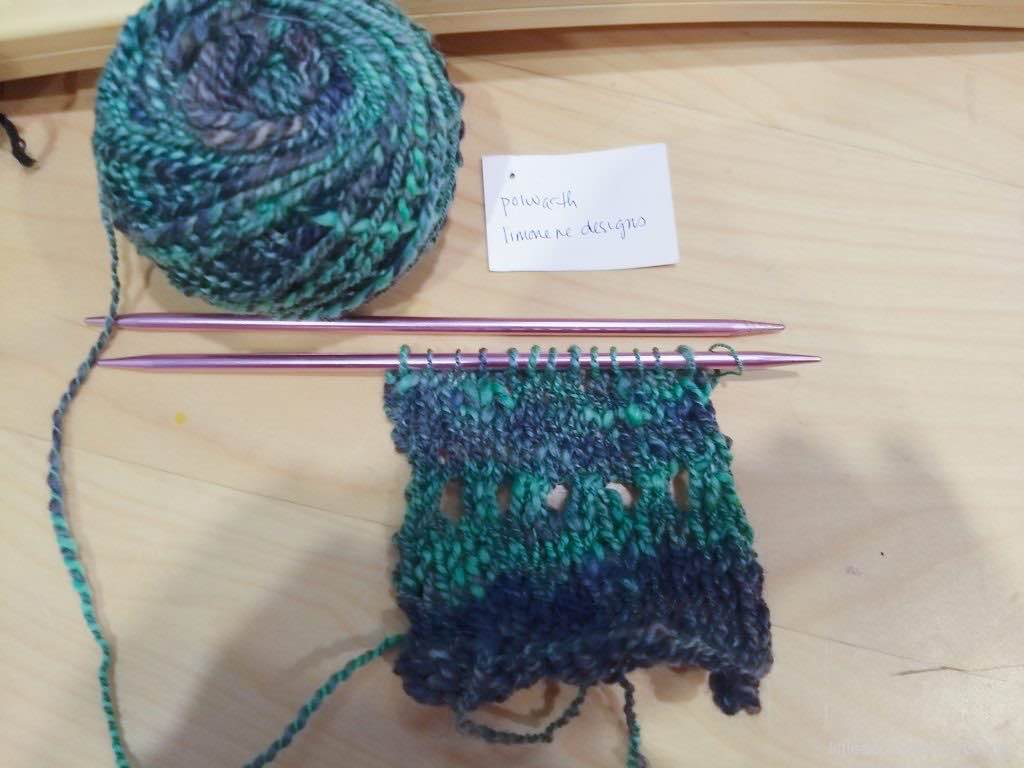 handspun yarn and small hand knit swatch. handwritten card notes "polworth. limonene designs"